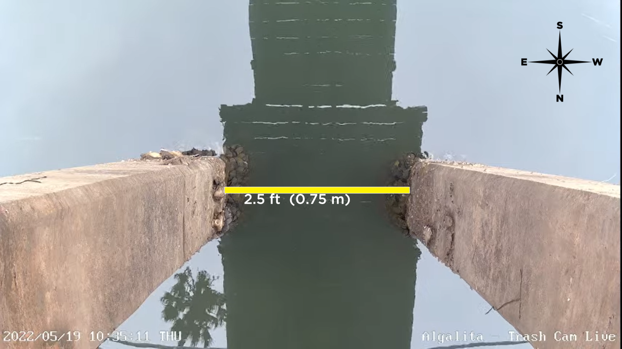 Image showing the visual scale and orientation  of the Trash Cam. The pillars in view are 2.5 ft apart and the Trash Cam looks straight down under the dock. The top of the field of view is oriented to the south. 