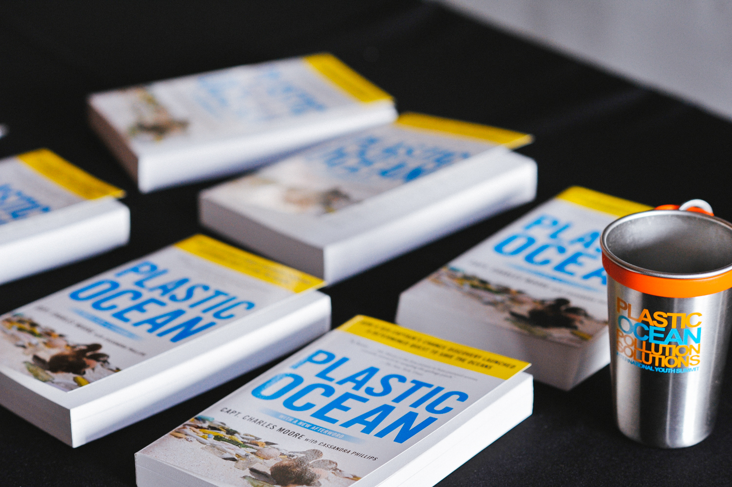 Project image card - copies of the book Plastic Ocean on a table