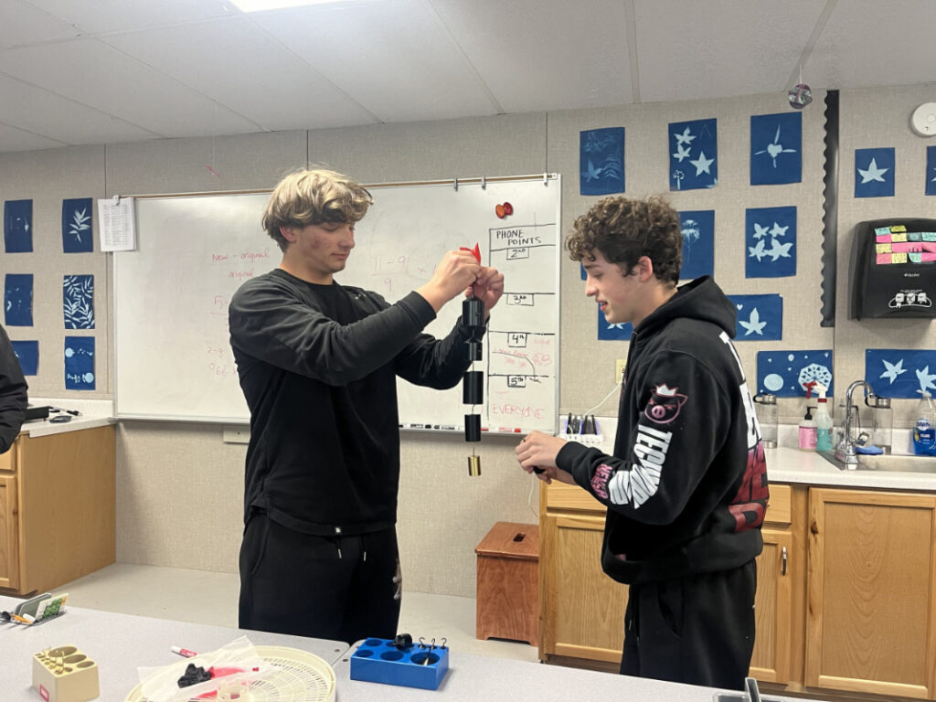 Students testing the strength of their bioplastics