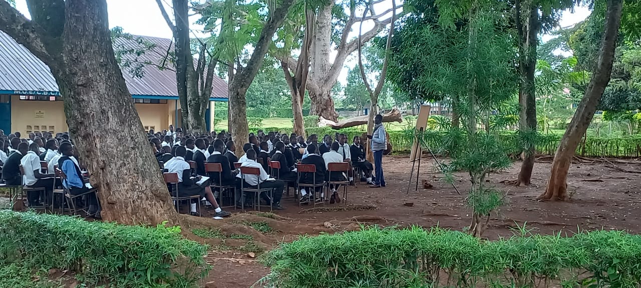 Mr. Ouma teaching a class