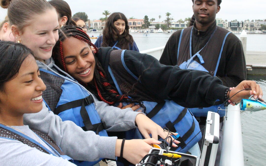 Students using an underwater camera.