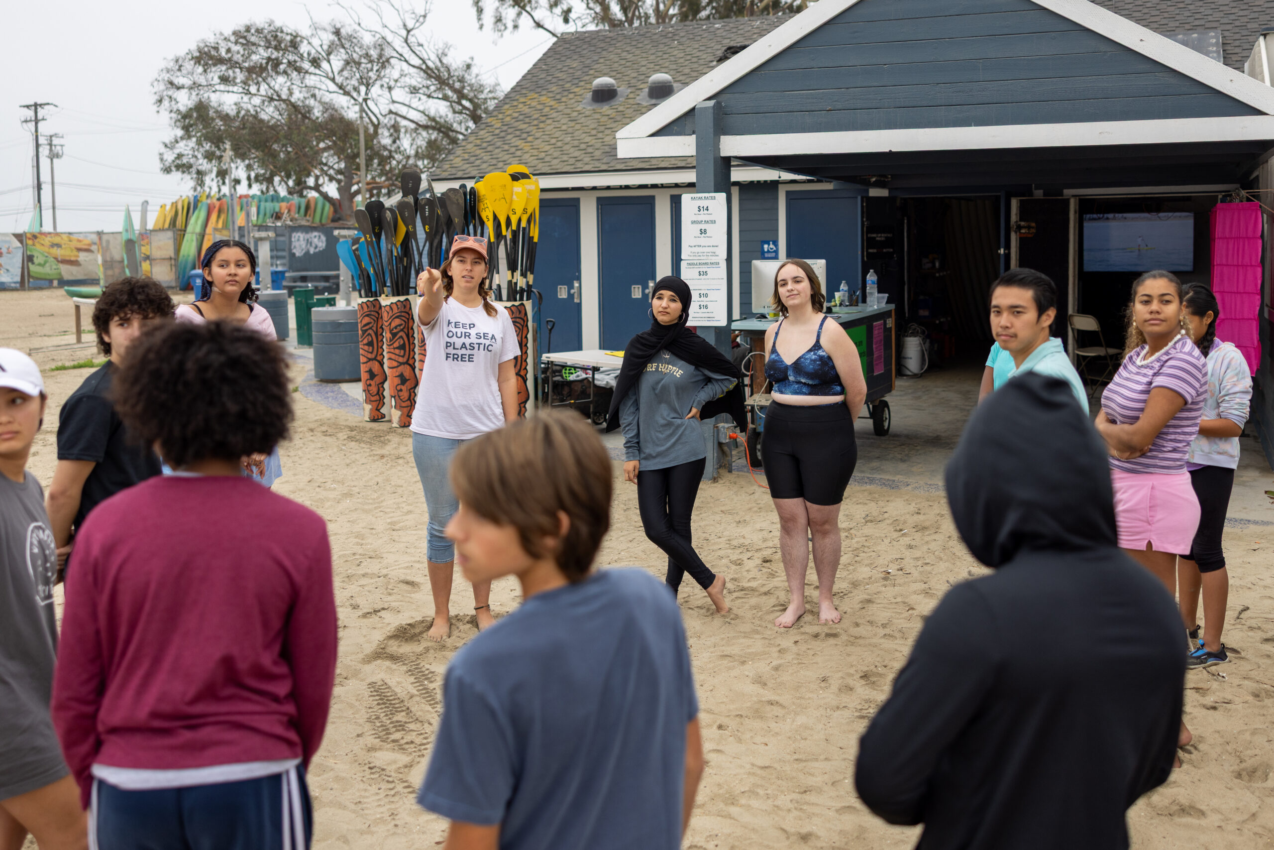 Educator and students talking at a watershed map.